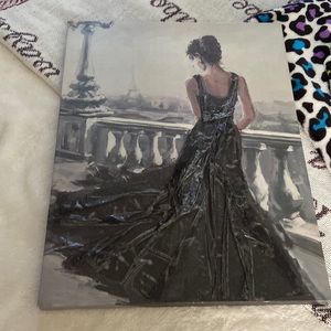 This is a picture of a woman looking at the Eiffel Tower